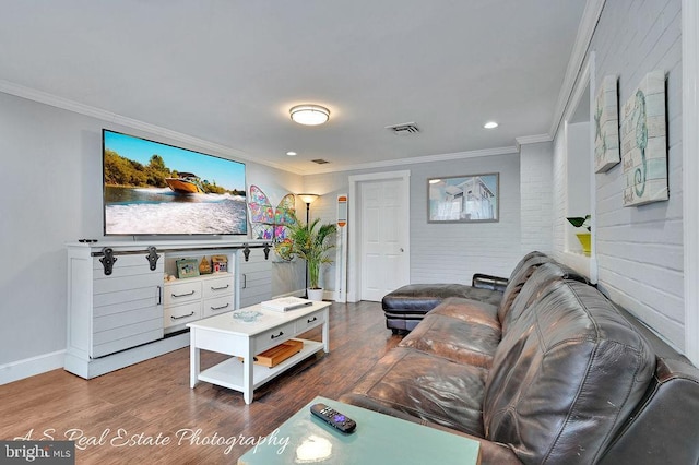 living room featuring ornamental molding and hardwood / wood-style floors