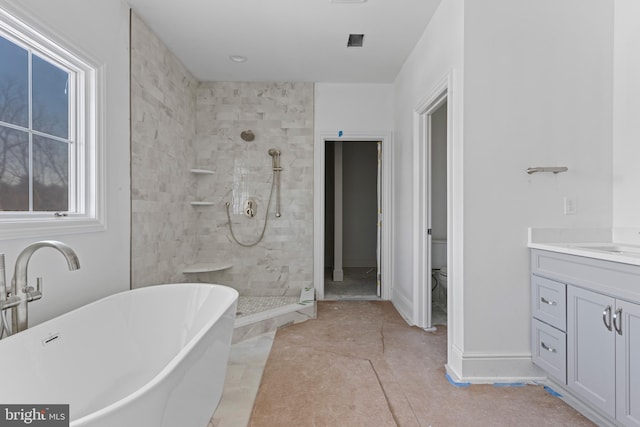 full bathroom featuring tile patterned floors, vanity, toilet, and independent shower and bath