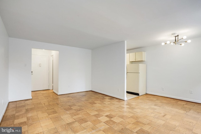 305 C St NE Unit 108, Washington, DC 20002 - spare room featuring a notable chandelier and baseboards