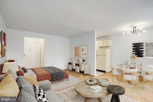305 C St NE Unit 108, Washington, DC 20002 - bedroom with freestanding refrigerator and a chandelier