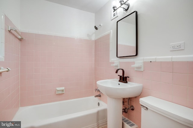 305 C St NE Unit 108, Washington, DC 20002 - bathroom with shower / tub combination, toilet, and tile walls