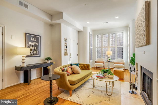 living area with light hardwood / wood-style floors