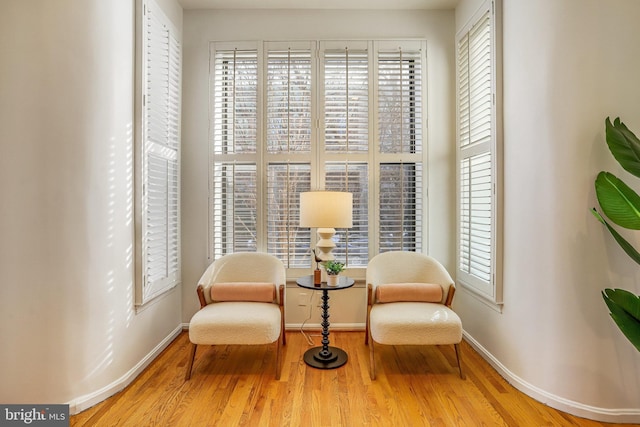 sitting room featuring hardwood / wood-style flooring