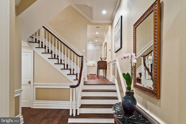 stairs with recessed lighting, wood finished floors, and crown molding