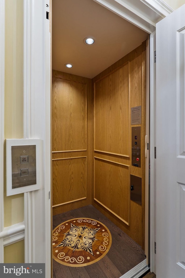 details featuring elevator and recessed lighting