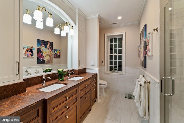 full bath with ornamental molding, a stall shower, a sink, and visible vents