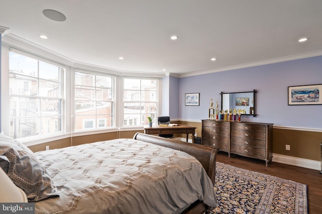 bedroom featuring baseboards, ornamental molding, wood finished floors, and recessed lighting