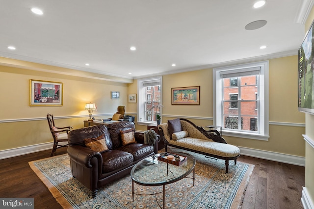 living area with dark wood-type flooring, recessed lighting, crown molding, and baseboards