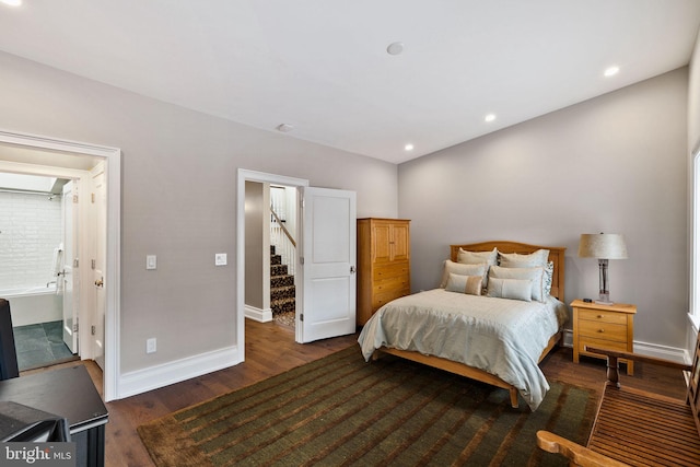 bedroom featuring ensuite bath, baseboards, wood finished floors, and recessed lighting