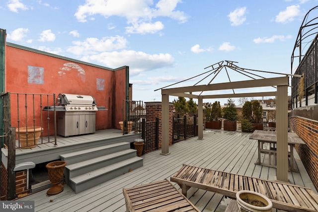 wooden deck featuring outdoor dining space and area for grilling