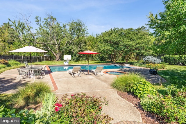 view of swimming pool with a fenced in pool, a lawn, a fenced backyard, an in ground hot tub, and a patio