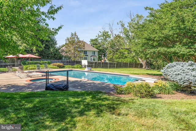 view of swimming pool featuring a patio, a fenced in pool, an in ground hot tub, a fenced backyard, and a lawn