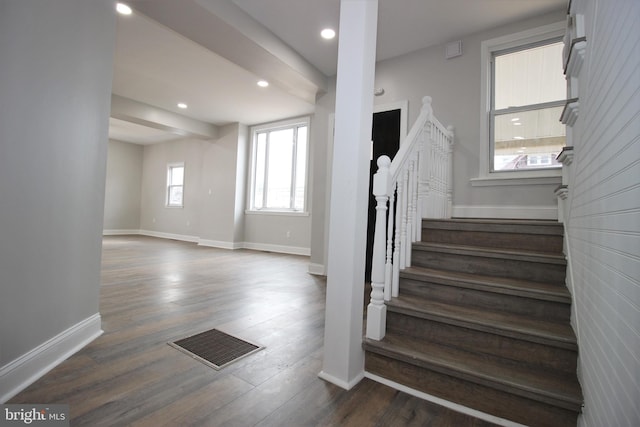 stairway featuring hardwood / wood-style floors