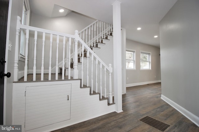 staircase with wood-type flooring