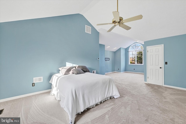 bedroom featuring ceiling fan, light colored carpet, and lofted ceiling