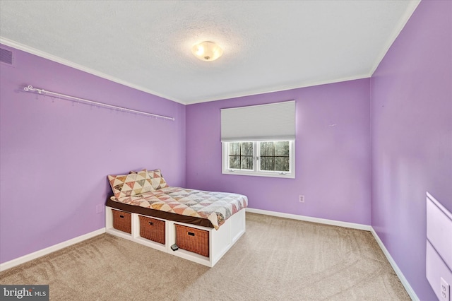 bedroom with carpet floors and a textured ceiling