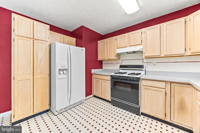 kitchen with light brown cabinets, gas range oven, white refrigerator with ice dispenser, and backsplash