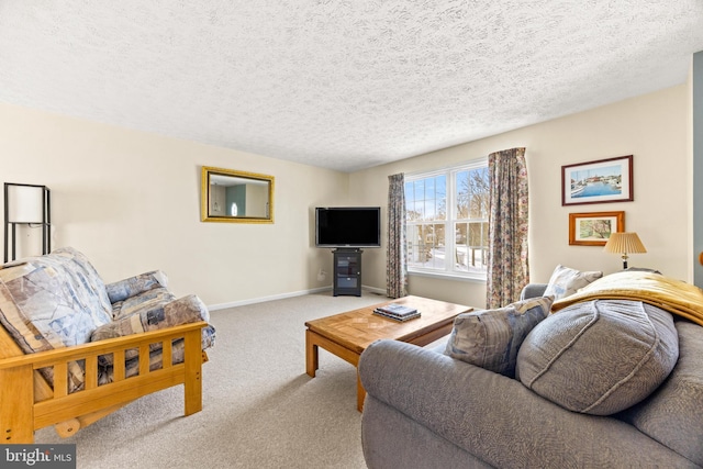 carpeted living room featuring a textured ceiling