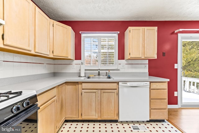 kitchen with decorative backsplash, a textured ceiling, sink, light brown cabinets, and dishwasher