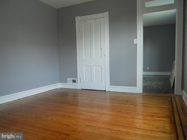 unfurnished room featuring light wood-type flooring