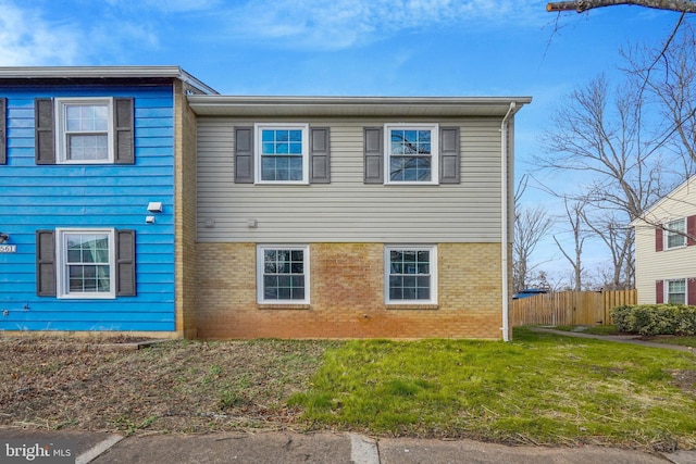 view of side of property featuring a yard