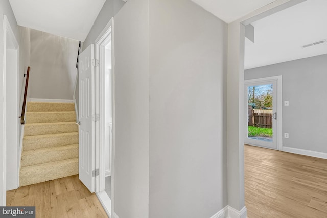 staircase featuring hardwood / wood-style flooring