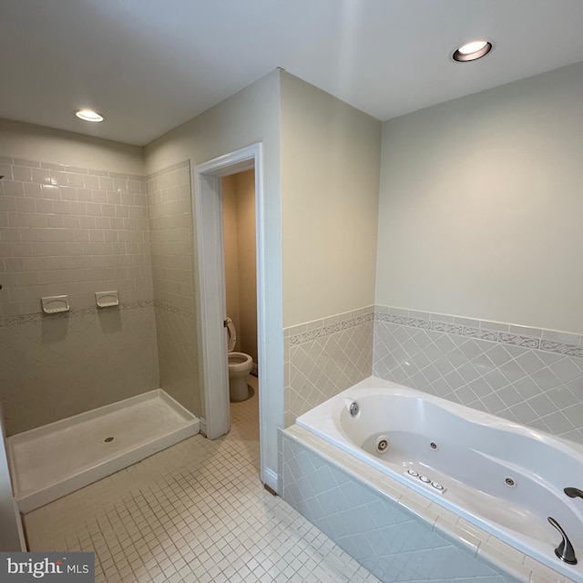 bathroom featuring toilet, tile patterned floors, and plus walk in shower