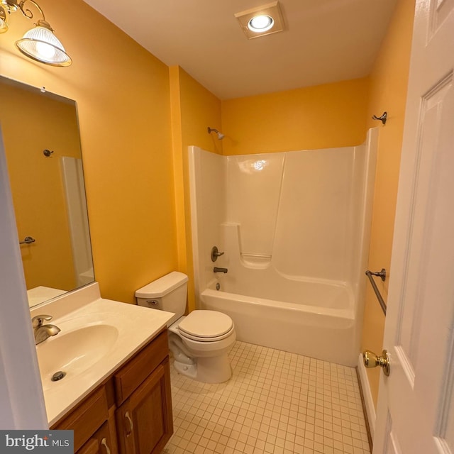 full bathroom with tile patterned flooring, shower / washtub combination, vanity, and toilet