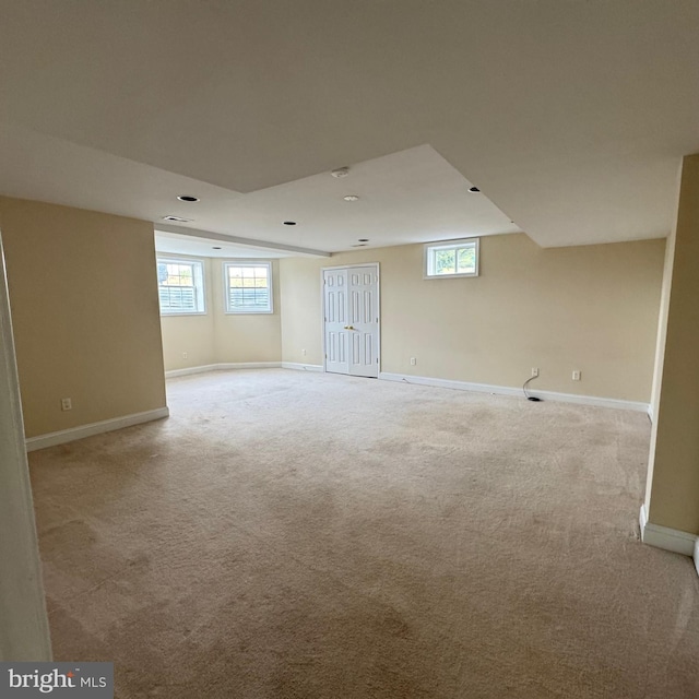 basement with light colored carpet