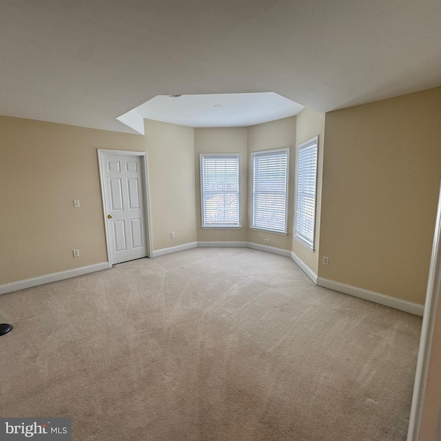 empty room featuring light carpet