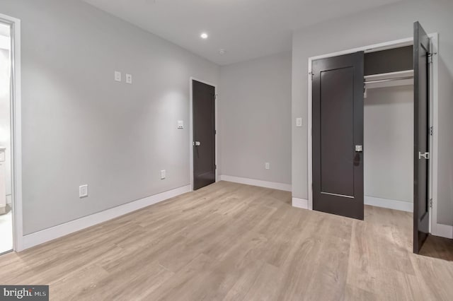 unfurnished bedroom featuring light wood-type flooring