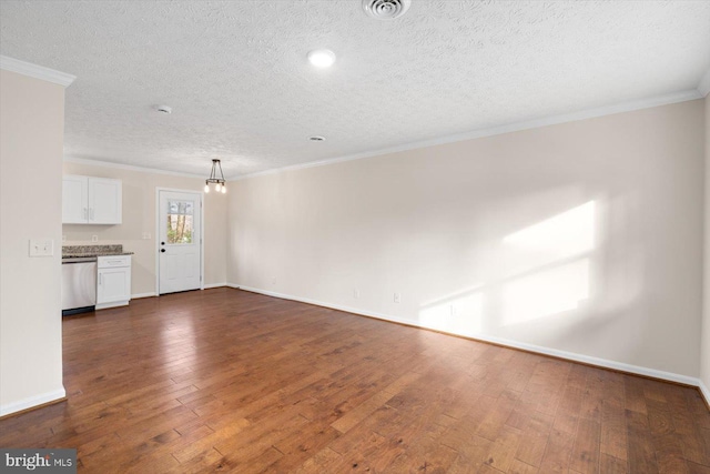 unfurnished living room featuring crown molding, dark wood-type flooring, a textured ceiling, and an inviting chandelier