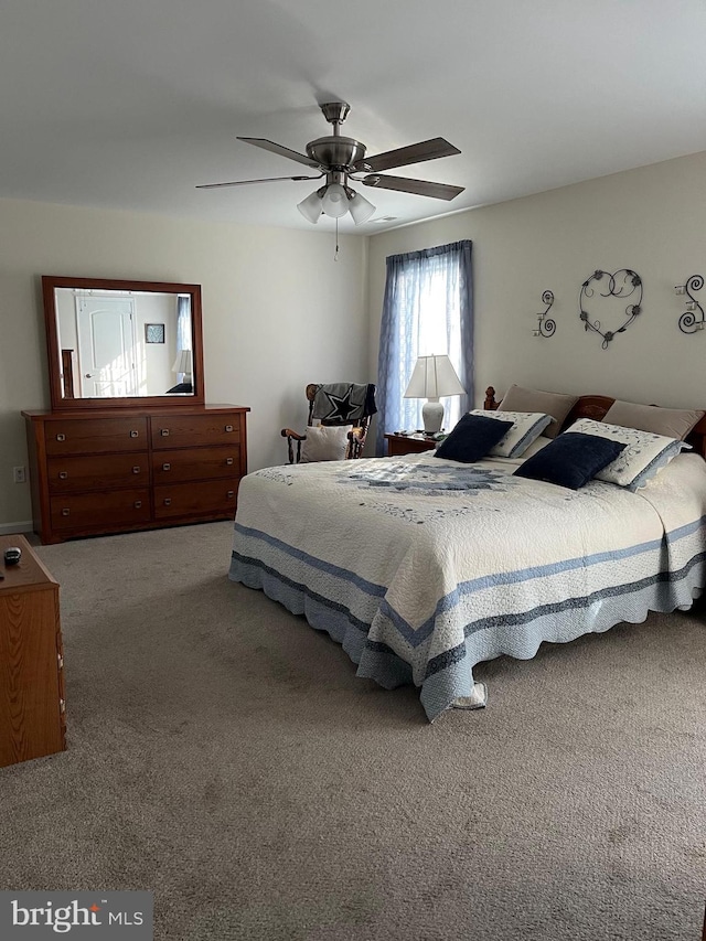 carpeted bedroom with ceiling fan