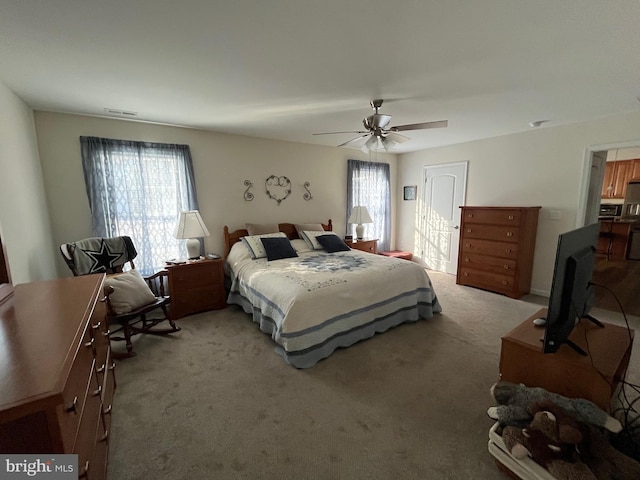 carpeted bedroom featuring ceiling fan