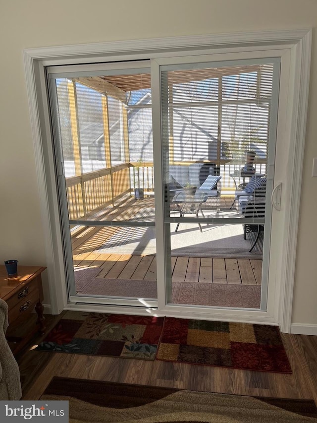 entryway with wood-type flooring