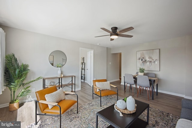 living room with hardwood / wood-style floors and ceiling fan