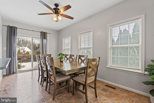 dining room featuring ceiling fan