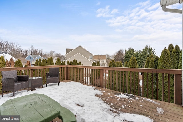 view of snow covered deck