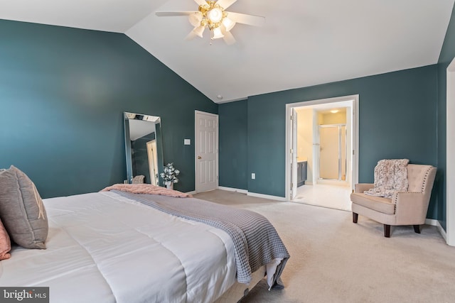 bedroom featuring vaulted ceiling, ceiling fan, ensuite bathroom, and light colored carpet