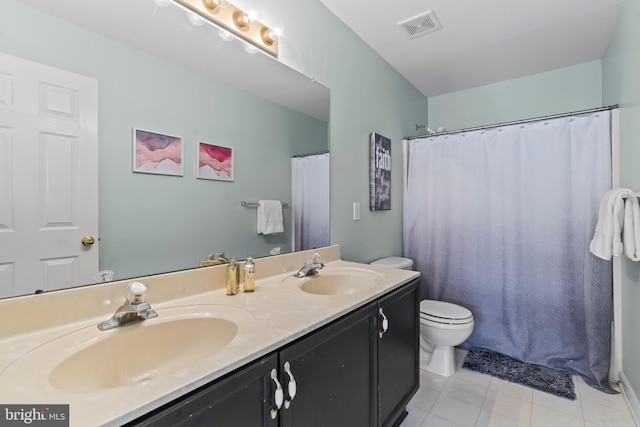 bathroom featuring tile patterned floors, toilet, vanity, and a shower with curtain