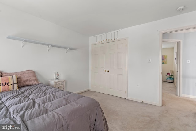 carpeted bedroom with a closet