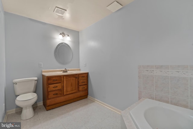 bathroom featuring toilet, vanity, a bathtub, and tile patterned floors