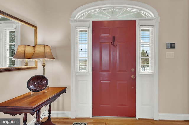 entryway with hardwood / wood-style floors