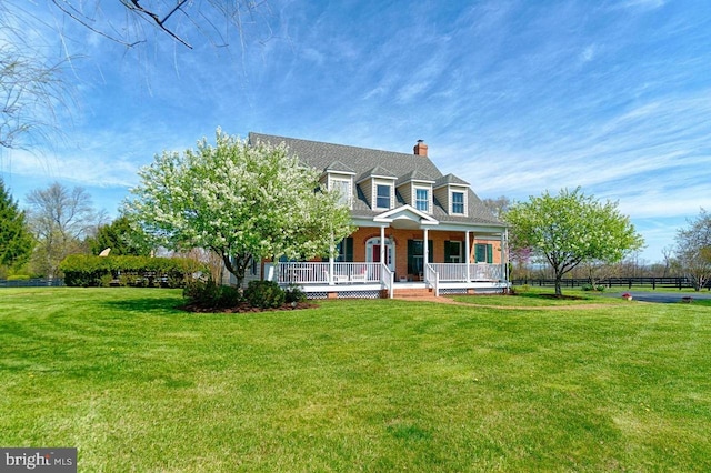 cape cod house with a front lawn and a porch