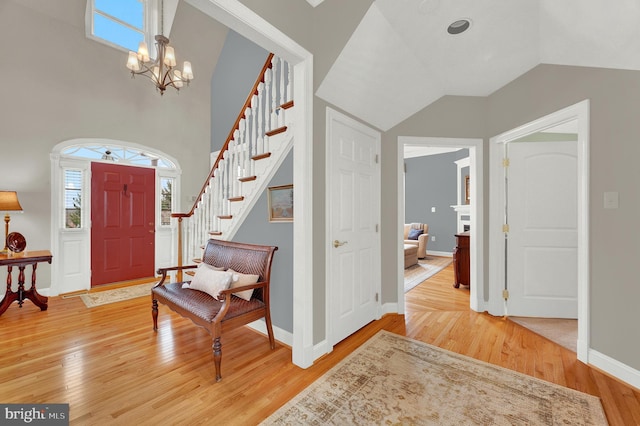 foyer with a chandelier and hardwood / wood-style floors