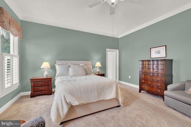 carpeted bedroom featuring ceiling fan and crown molding