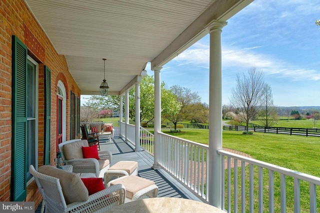 view of patio featuring a rural view and a porch