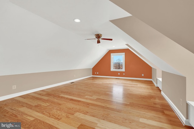 bonus room featuring ceiling fan, vaulted ceiling, and light hardwood / wood-style flooring