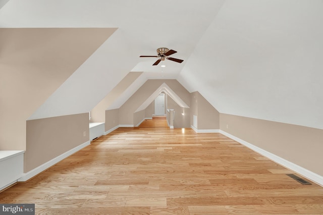 bonus room with ceiling fan, vaulted ceiling, and light hardwood / wood-style floors