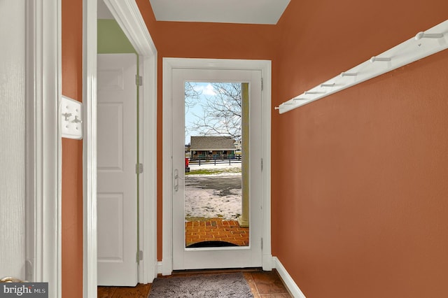 entryway featuring plenty of natural light and tile patterned floors